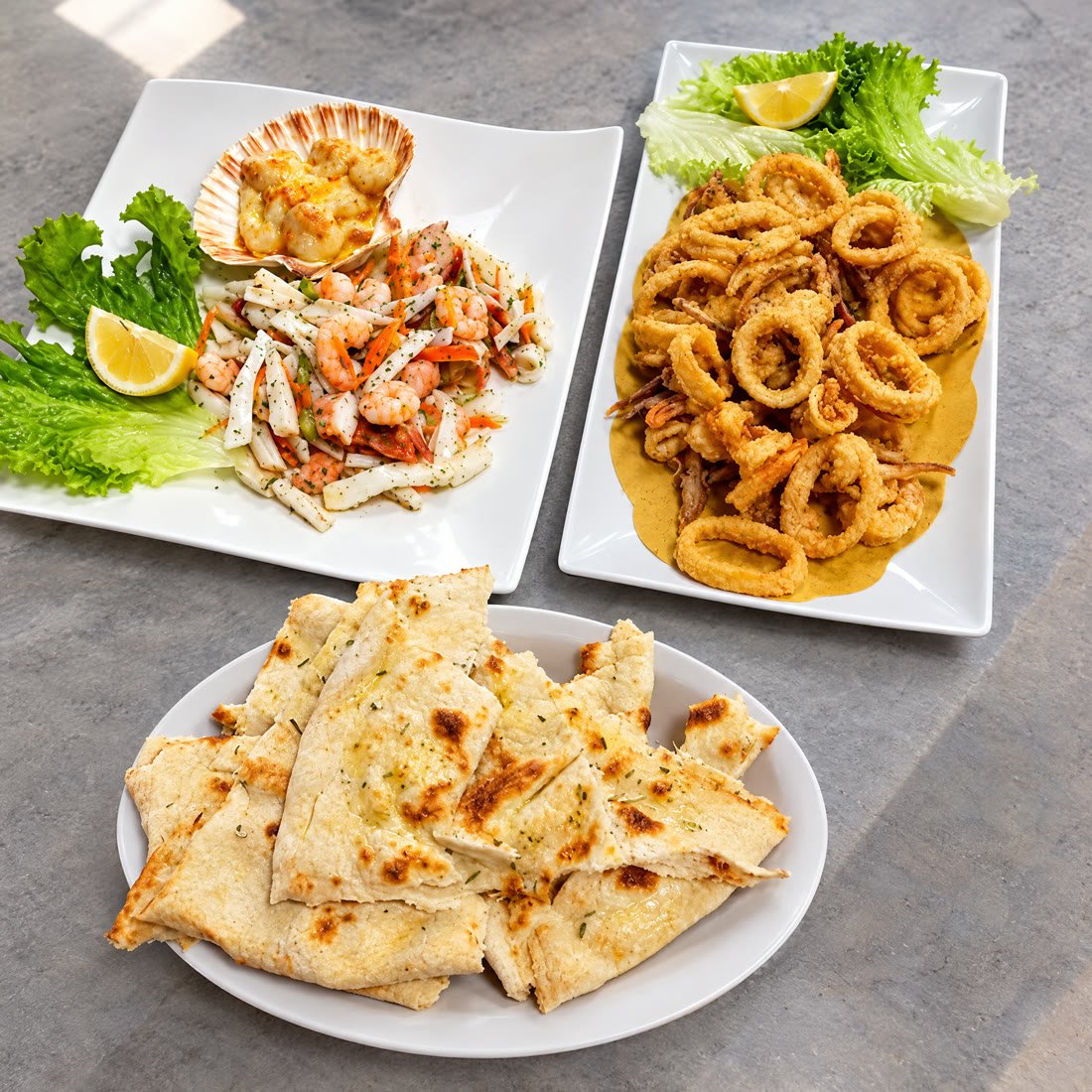 Capasanta gratinata, insalata di mare e calamari